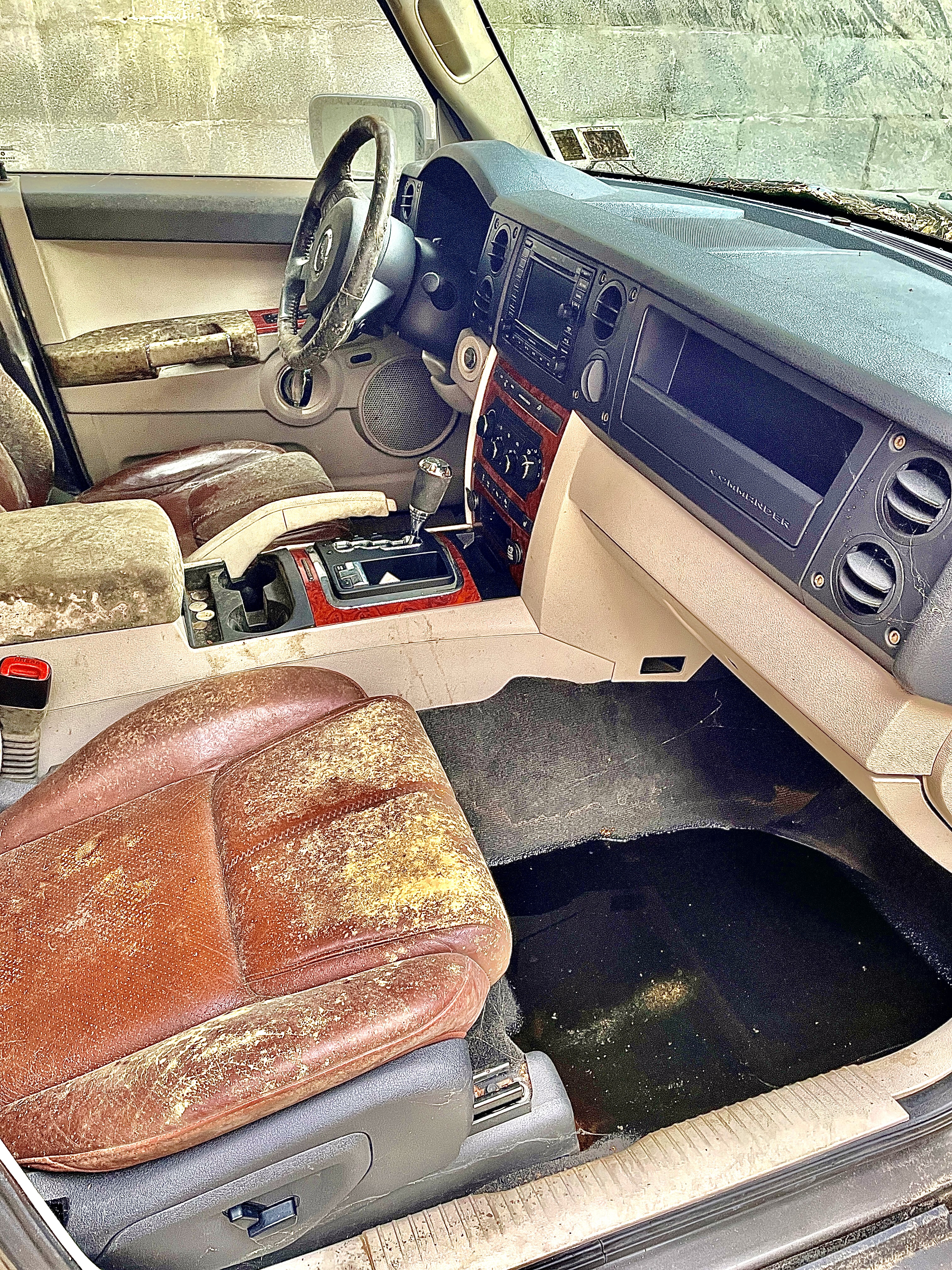 Dirty Jeep Commander passenger cabin before